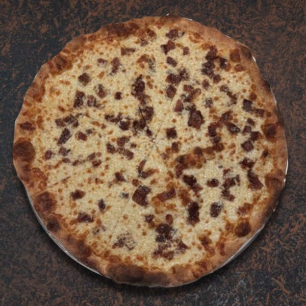 Whole round pizza with white cheese and bacon bits, sliced into eight pieces on a dark surface.